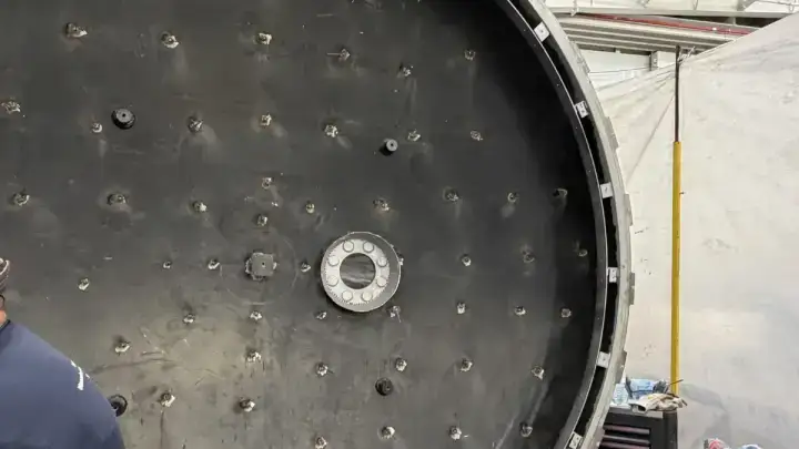 Autoclave door face covered in welded insulation pins, ready for its removable cover.