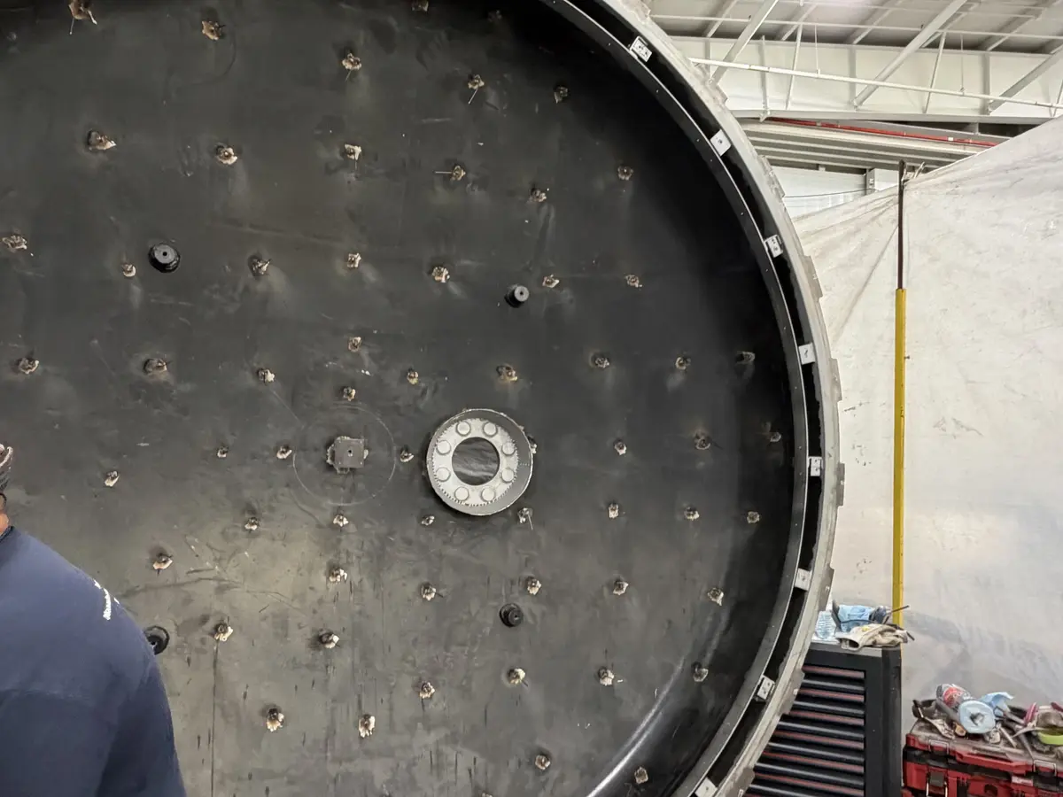 Autoclave door face covered in welded insulation pins, ready for the removable cover.